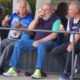 Norm Box, Des Leigh and Max Mannik discuss the game while enjoying a snag and a beer. - ERBR Men's Pairs Final 2022-2023